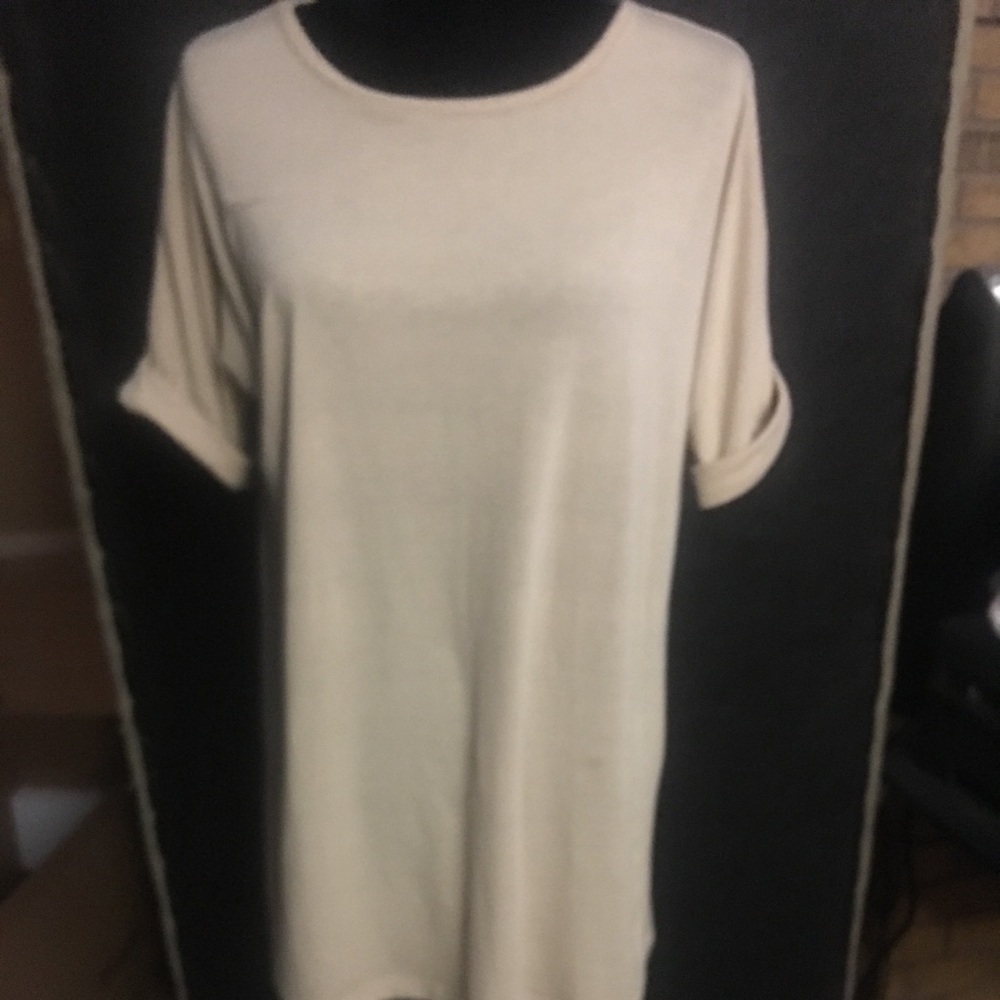 Tan plain tunic with lace on back.